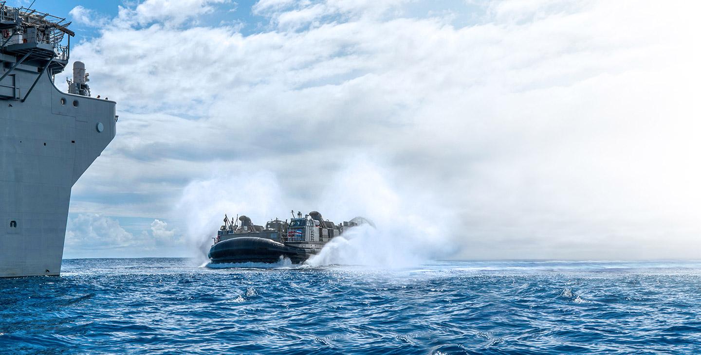 LCACS ship approaching a carrier out at sea